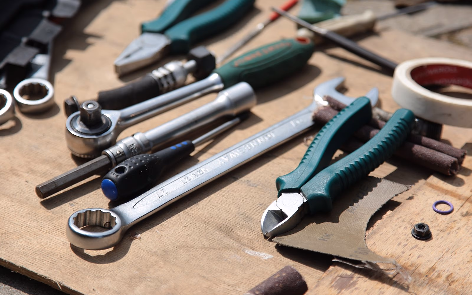 An engineer’s hand tools laid out on a workbench